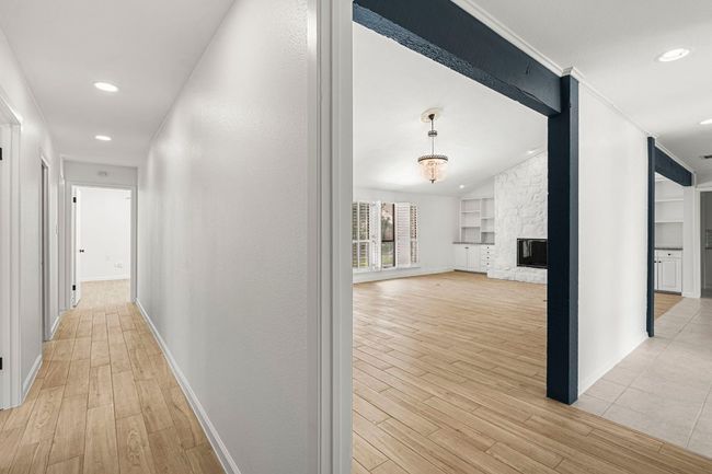 Corridor featuring light wood finished floors, recessed lighting, and crown molding | Image 22