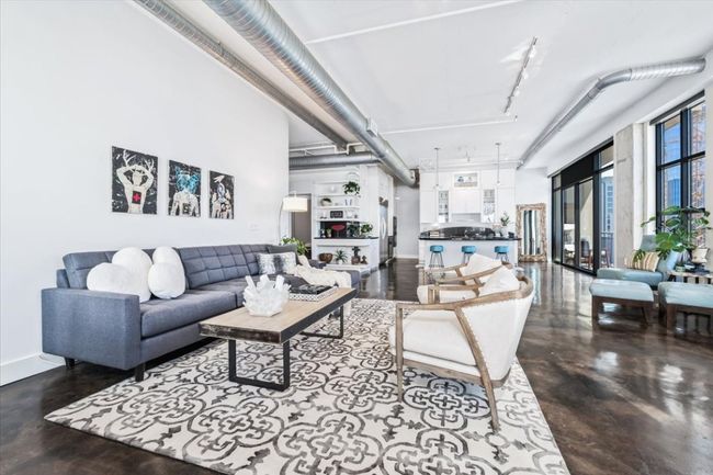 View of living area back to kitchen. | Image 16