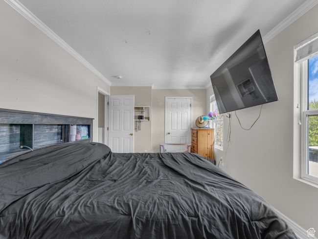 Bedroom featuring crown molding | Image 25