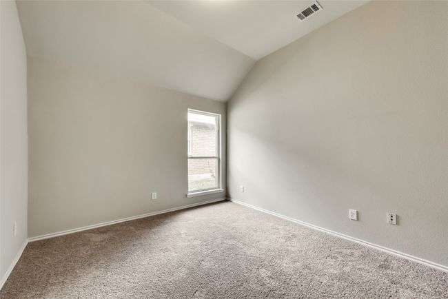 Carpeted empty room with vaulted ceiling and baseboards | Image 27
