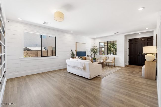 Living room with recessed lighting, wood finished floors, and visible vents | Image 6