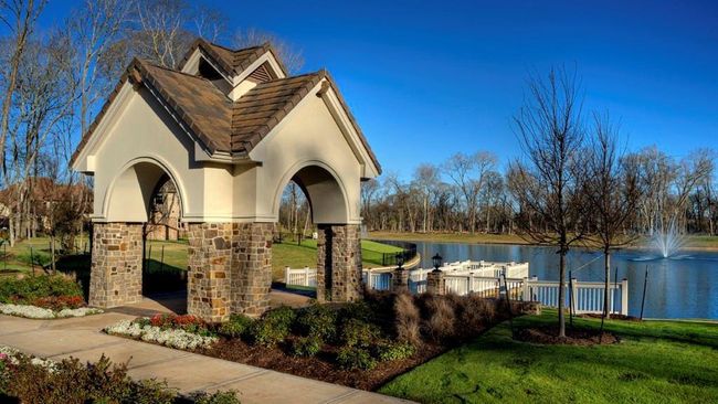 Enjoy the serene views of the lake and its charming pier, offering a peaceful retreat in the heart of Riverstone. This tranquil waterfront setting provides the perfect spot for relaxing, fishing, or simply taking in the natural beauty of your surroundings. | Image 11