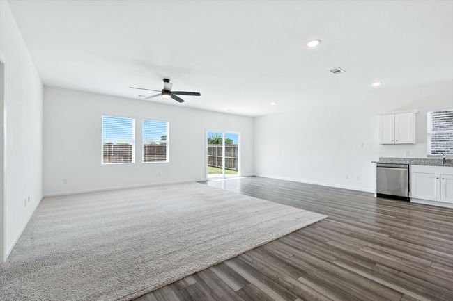 Unfurnished living room with recessed lighting, dark wood-style flooring, and ceiling fan | Image 5