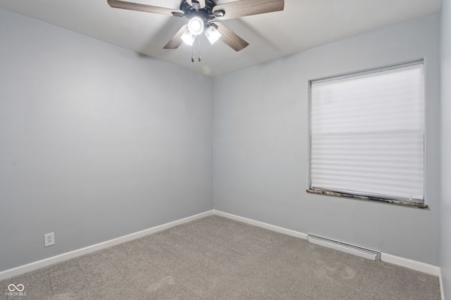 empty room featuring carpet flooring, ceiling fan, and baseboards | Image 22