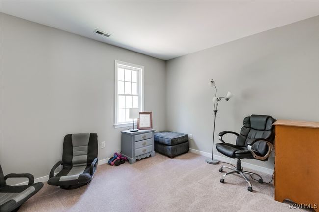 Bedroom with baseboards and light colored carpet | Image 23