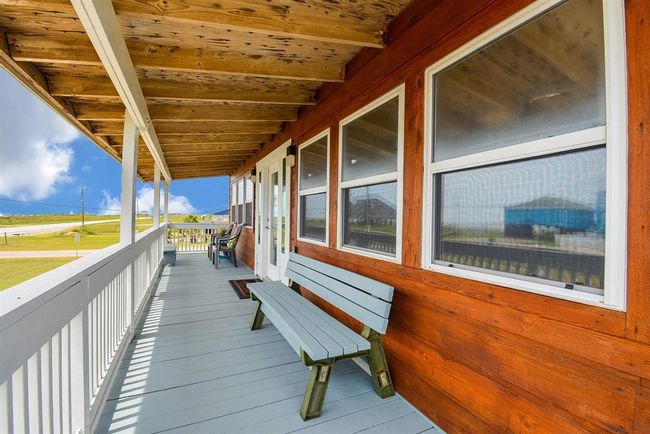 Have a seat and watch the Sunrise on the covered front deck. | Image 19