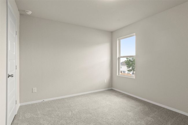 Spare room with a smoke detector and light colored carpet | Image 30