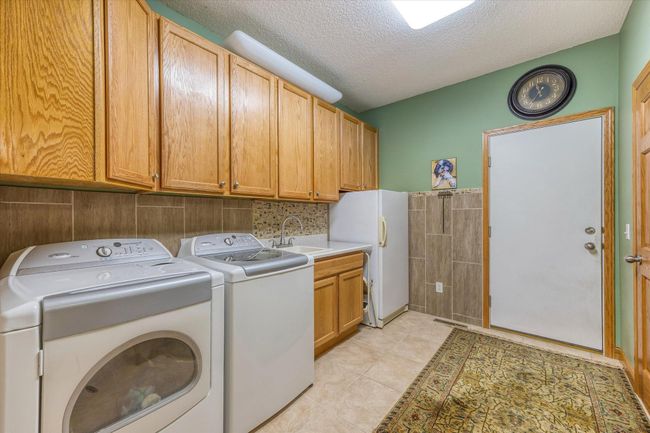 Laundry/garage entry/mud room, located immediately off garage | Image 20