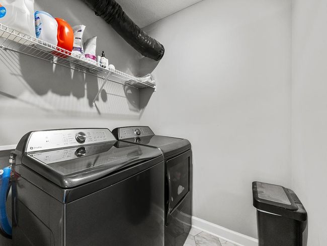 Upper level laundry space. | Image 24