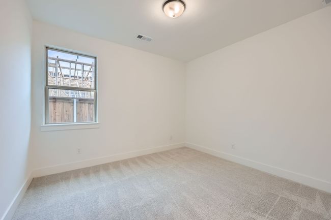 Empty room with baseboards, carpet flooring, and visible vents | Image 24