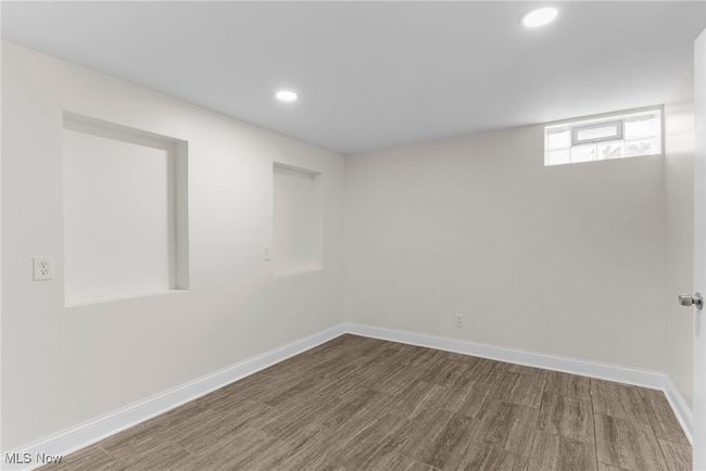 Spare room featuring recessed lighting and wood finished floors | Image 29