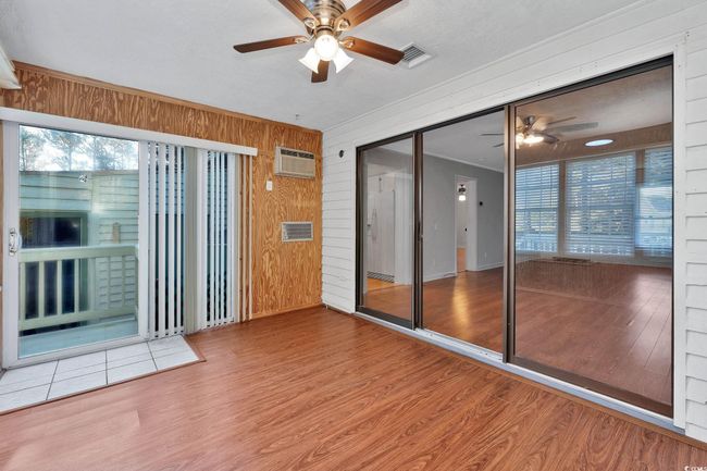 Unfurnished sunroom with ceiling fan | Image 7