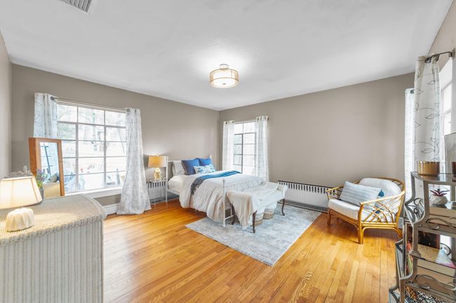 Second Bedroom wood finished floors and bright light. | Image 29