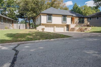 View of front of house featuring a garage and a front lawn | Image 3