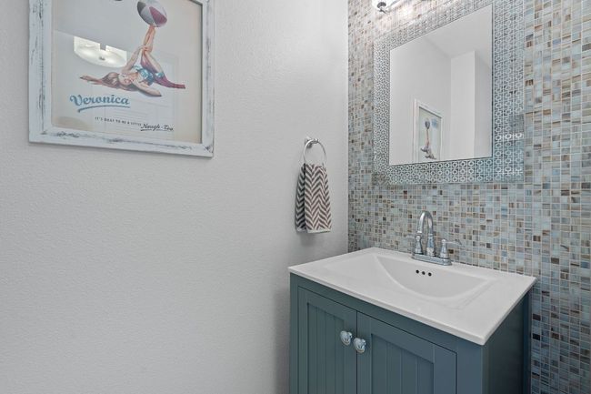 Bathroom with vanity and tile walls | Image 13