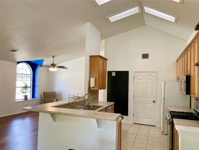 Soaring kitchen ceiling, fun blackboard wall | Image 5