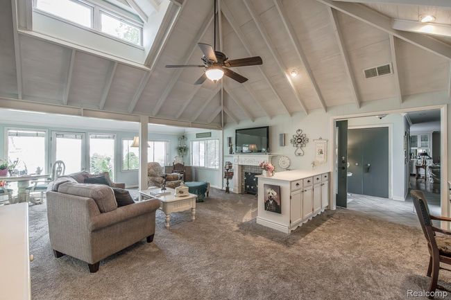 Natural light floods the living room | Image 10