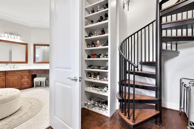 One of the standout features is her closet, which includes a charming spiral staircase that leads directly to a private second-floor hobby room, offering a unique and functional extension of the space. | Image 27