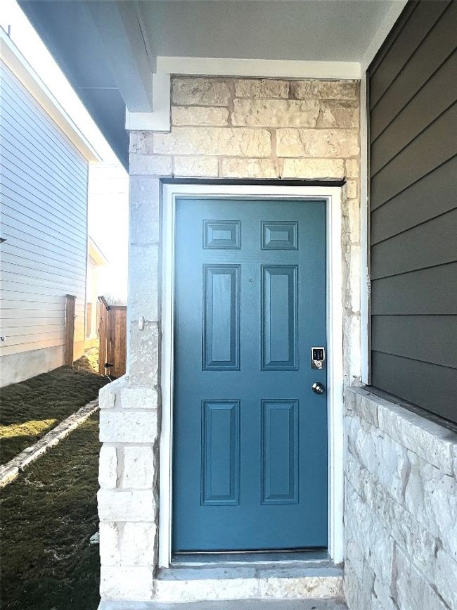 Entrance to property with stone siding | Image 6