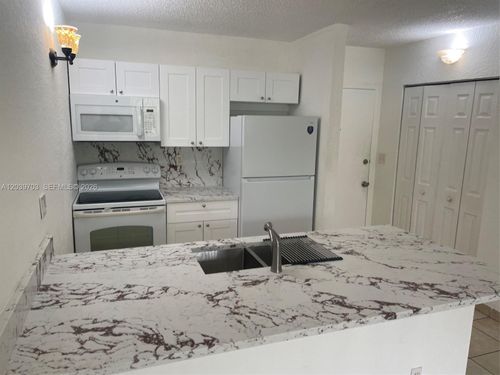 203b-2401 Riverside Dr, Coral Springs, FL, 33065-5664 | Card Image