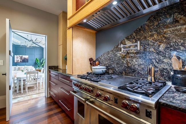 Unleash your culinary creativity with the professional-grade Wolf range, featuring six burners, flat top griddle and double ovens-designed to handle everything from everyday meals to gourmet feasts | Image 23