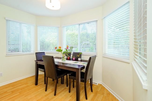 Dining space featuring light wood-style flooring and baseboards | Image 10