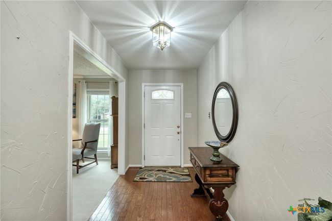 Inviting entry with beautiful wood floors. | Image 5
