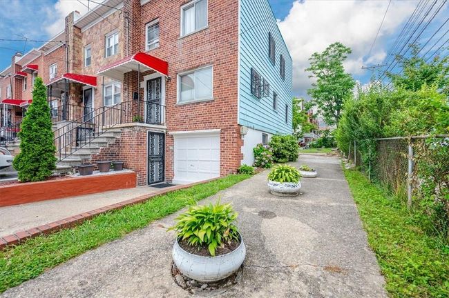 View of front of property with a garage | Image 18