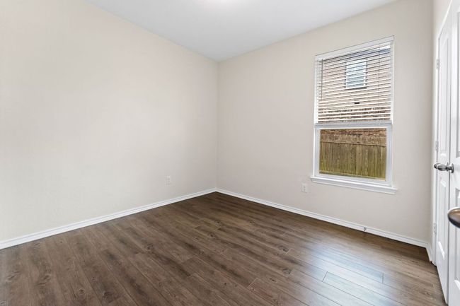 Guest 2 room featuring dark wood finished floors and baseboards | Image 23