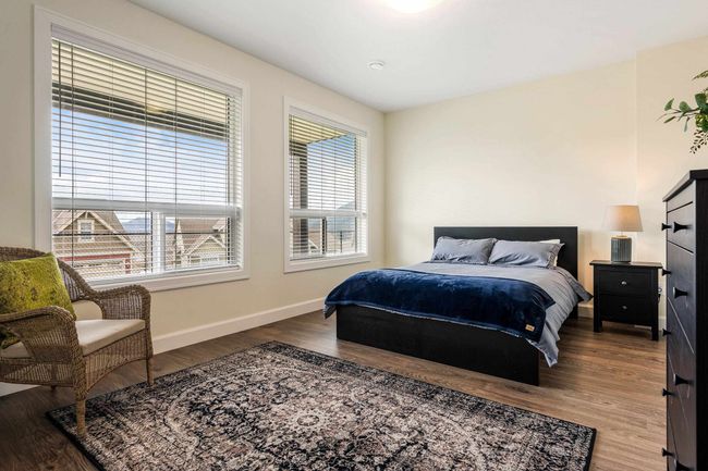 Bedroom featuring baseboards and wood finished floors | Image 33