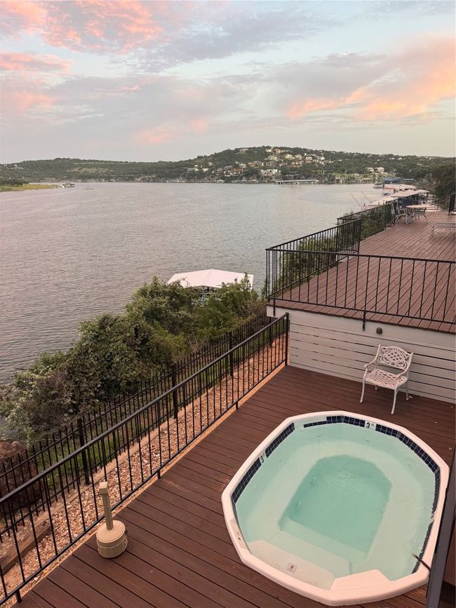 View of pool with a deck with water view | Image 28