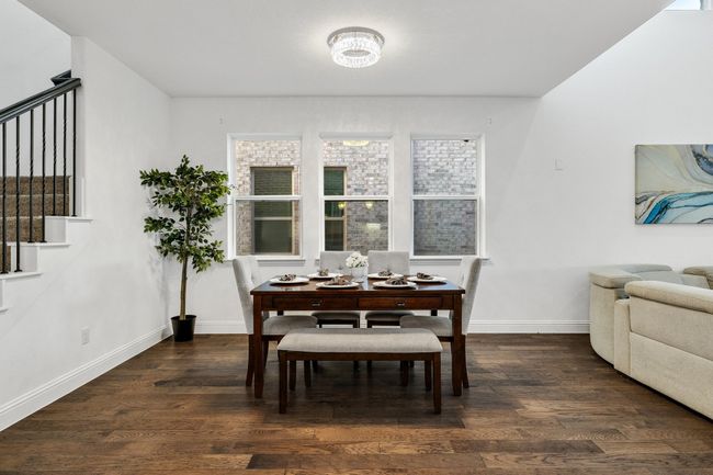 Dining area with dark wood-type flooring | Image 8