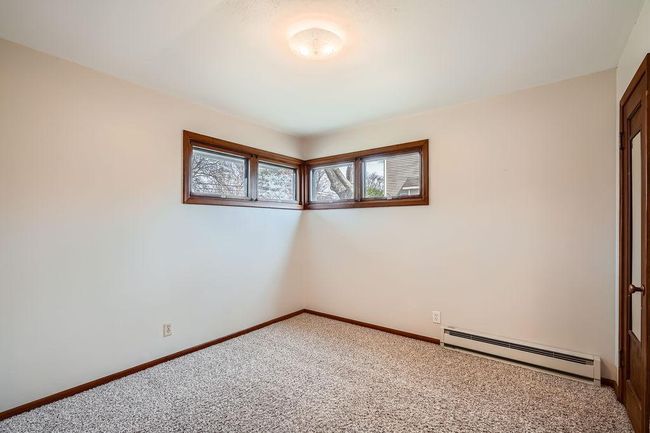 One of 3 bedrooms - carpets professionally cleaned. Ready to move in and enjoy! | Image 17