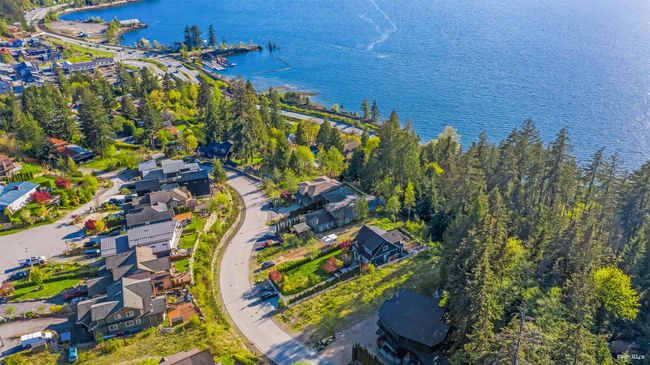 Aerial view of property's location with a large body of water and nearby suburban area | Image 13