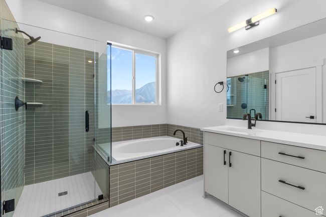 PRIMARY SUITE BATHROOM W/ SEPERATE TUB & SHOWER...WHITE CABINETS...QUARTZ COUNTERTOPS AND UPGRADED BLACK FAUCETS & HARDWARE! (PICTURE IS FROM A PREVIOUSLY BUILT HOME) | Image 6