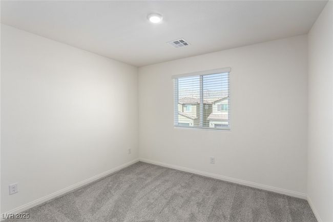 Empty room featuring carpet, visible vents, and baseboards | Image 22