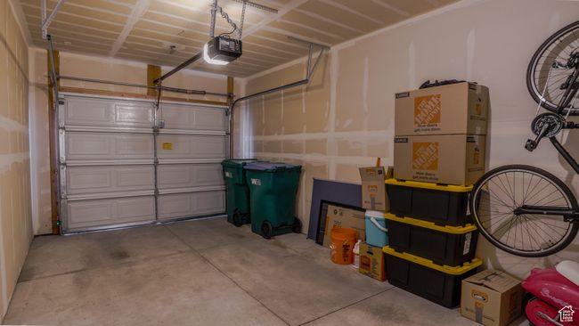 Garage featuring a garage door opener | Image 31