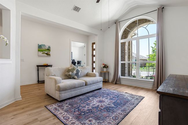 LARGE WINDOWS AND WARM TONES ADORN THIS LIVING ROOM !!! | Image 4