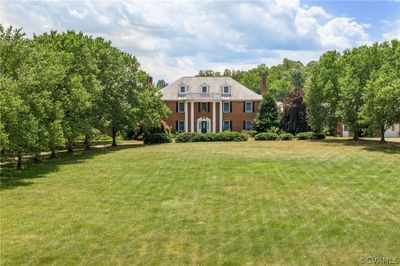 Colonial inspired home with a front lawn | Image 2