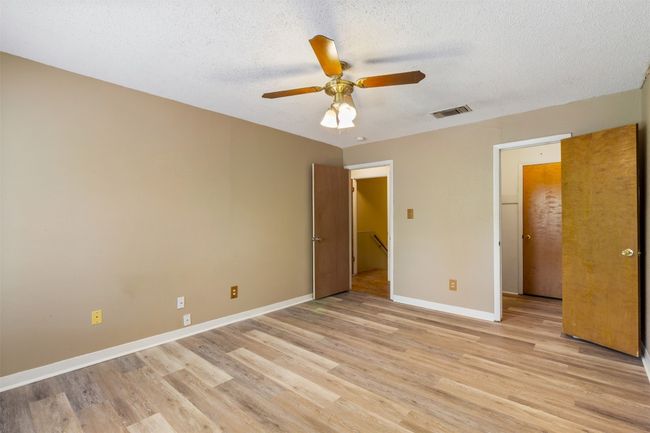 Bedroom features walk-in closet and bonus storage room | Image 17