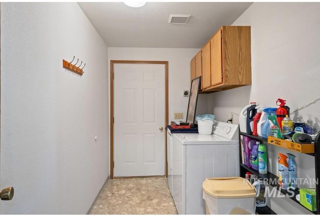Washroom with cabinet space and washer and clothes dryer | Image 22