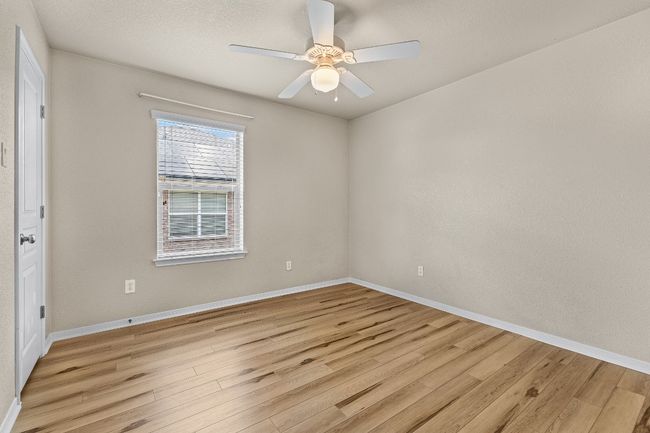 Unfurnished room featuring light wood-type flooring and a ceiling fan | Image 28