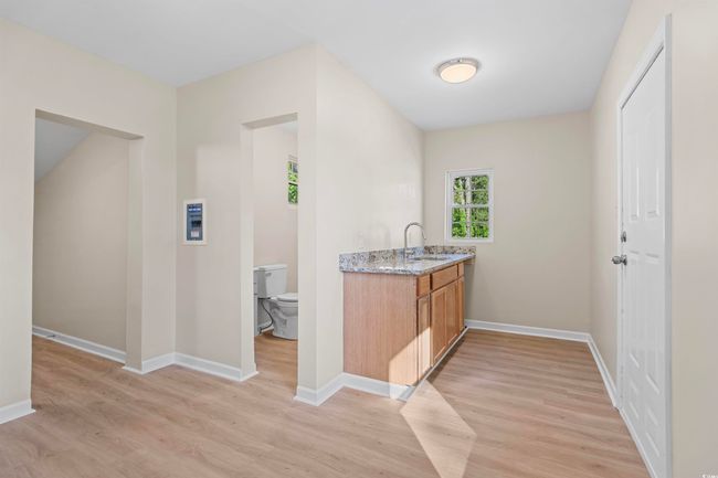 Bar area with light wood finished floors | Image 33