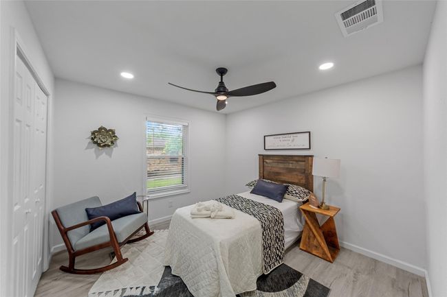 Bedroom with recessed lighting, light wood-style floors, a closet, and ceiling fan | Image 13