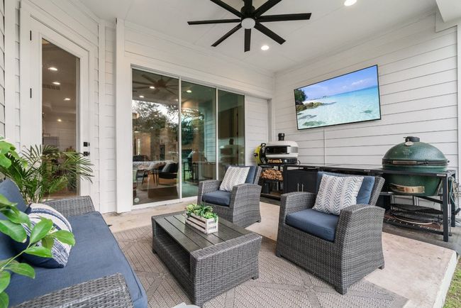 Deck featuring a ceiling fan, a patio, and an outdoor hangout area | Image 36