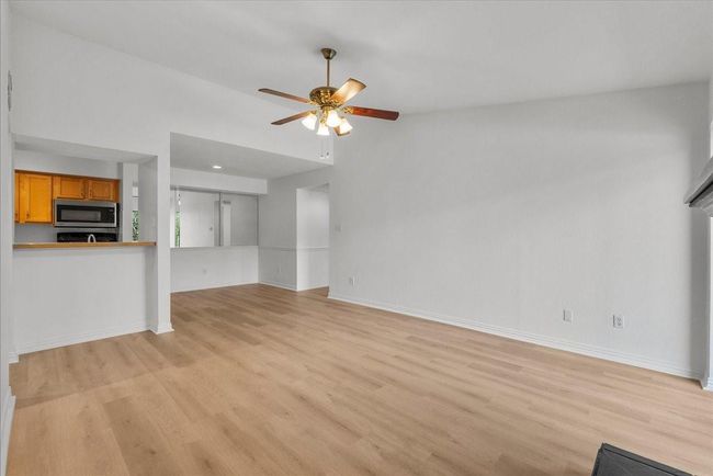 Spacious living room with natural light and open layout | Image 6