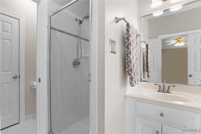 First floor primary bathroom with walk-in shower | Image 16