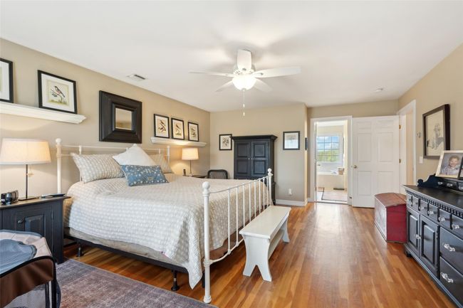 Bedroom with baseboards and light wood-style flooring | Image 30
