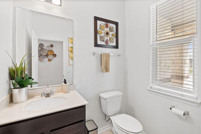 Bathroom featuring plenty of natural light and vanity | Image 7