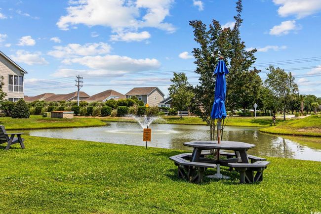 View of community with a yard and a water view | Image 27